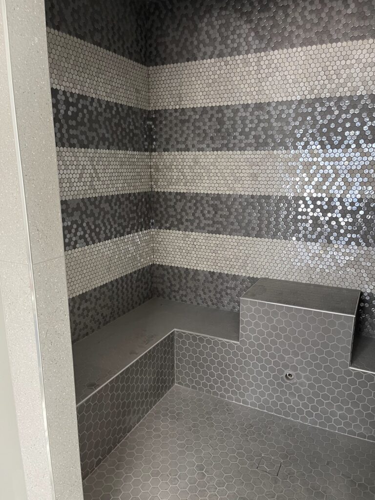 Modern bathroom renovation with tiled shower in Calgary