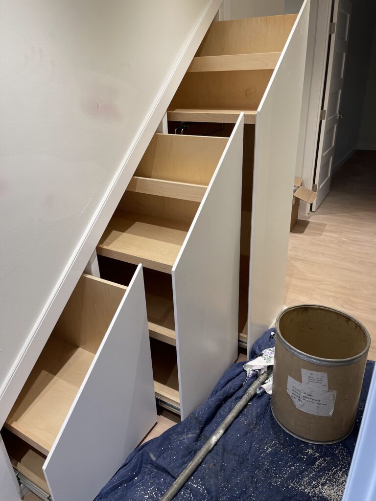 Built-in shelving and custom storage installation in Calgary home
