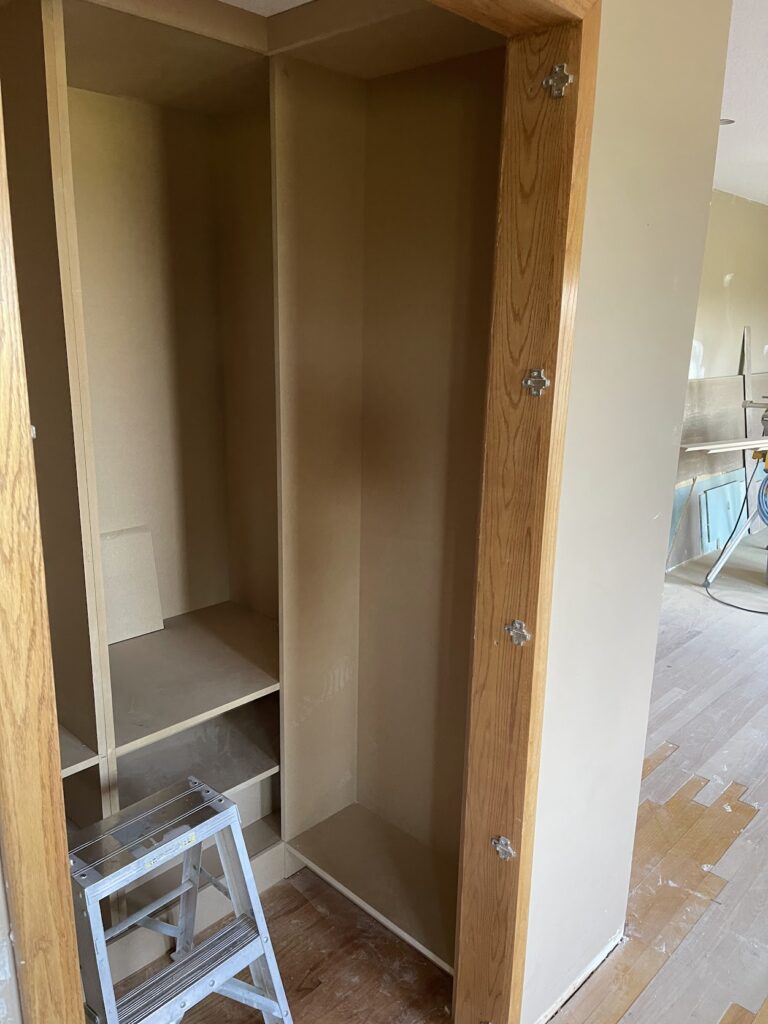 Kitchen cabinet finishing work during Calgary renovation project