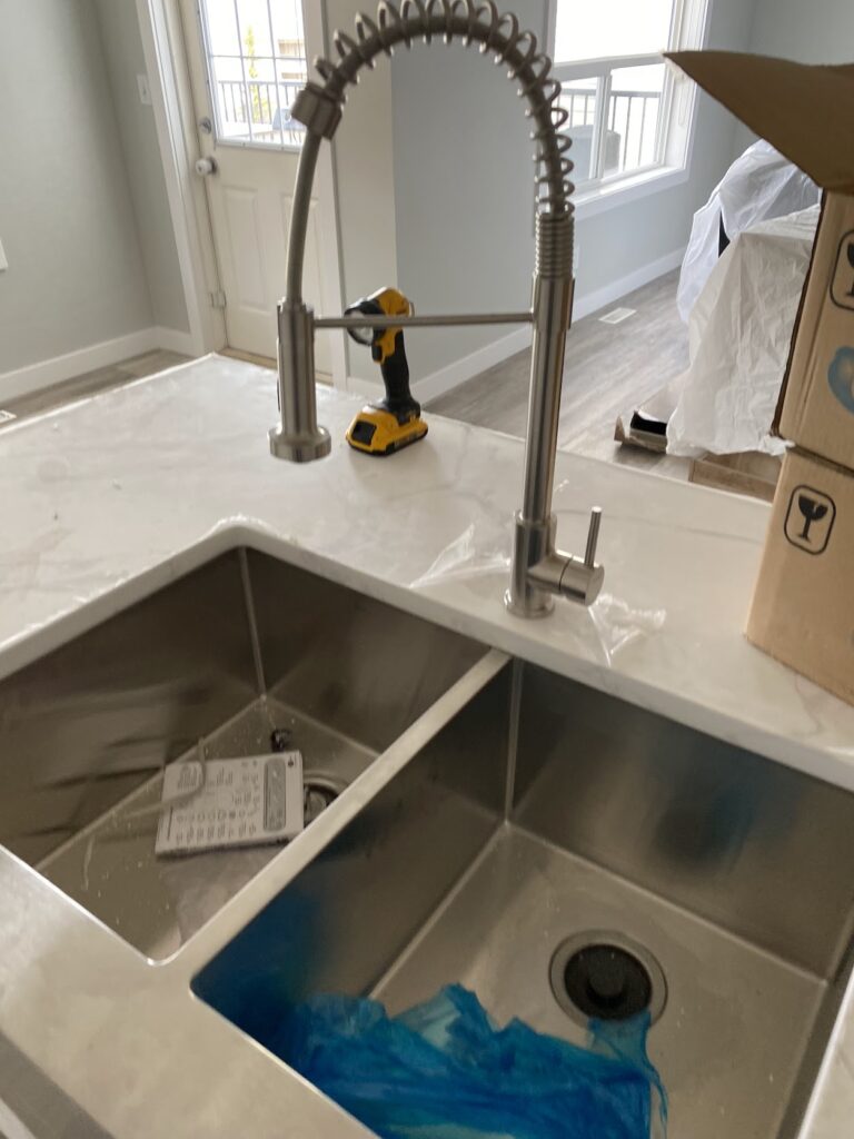 Bathroom sink and faucet installation during Calgary home renovation