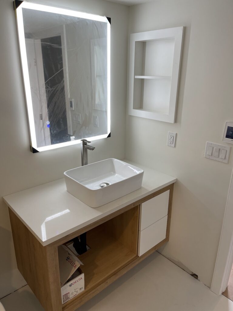 Bathroom vanity and mirror installation completed in Calgary home renovation