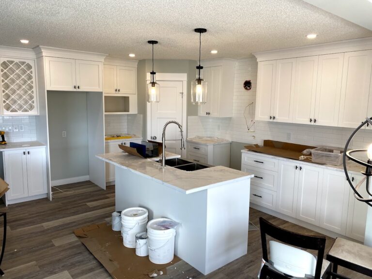 Complete kitchen remodeling with island and modern cabinetry in Calgary