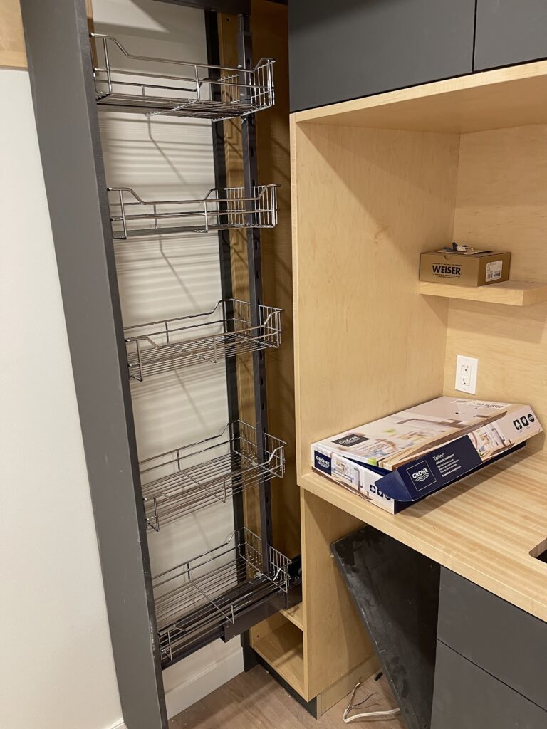 Custom workspace cabinetry with integrated shelving in Calgary home
