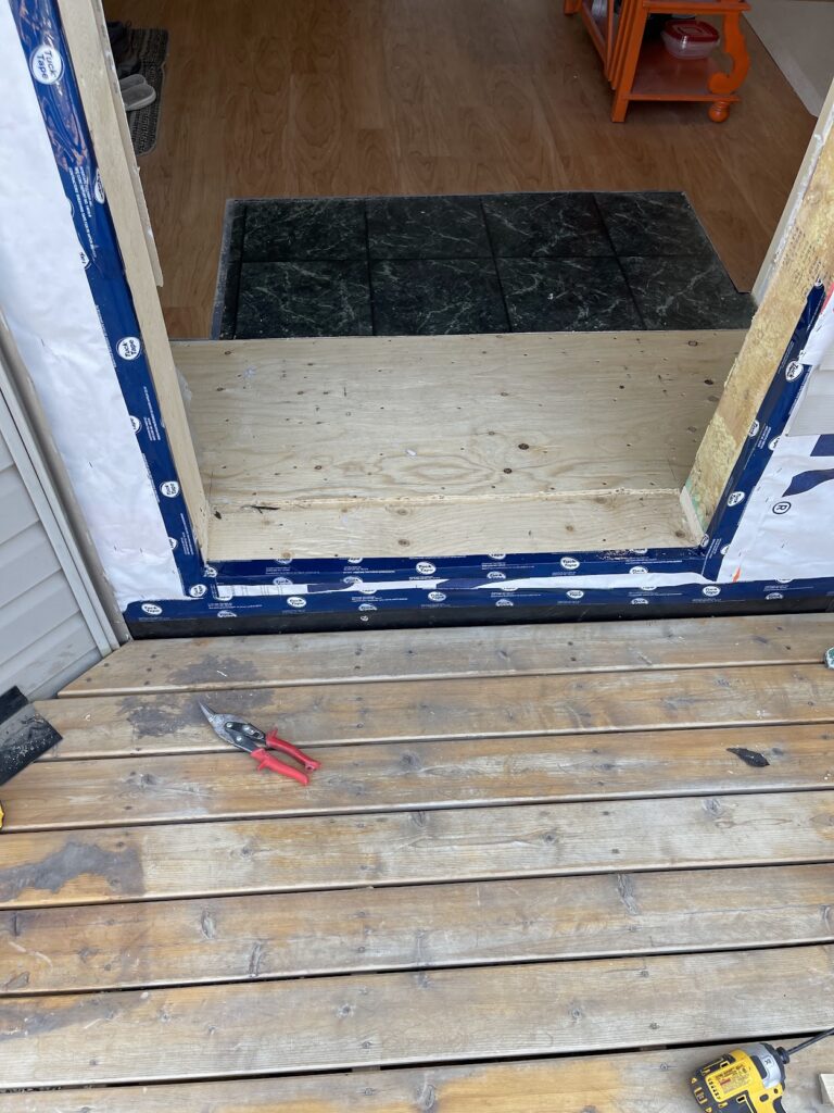 Exterior door threshold and entry area repair during Calgary home renovation
