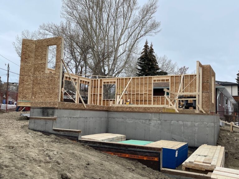 Exterior home extension construction during Calgary renovation project