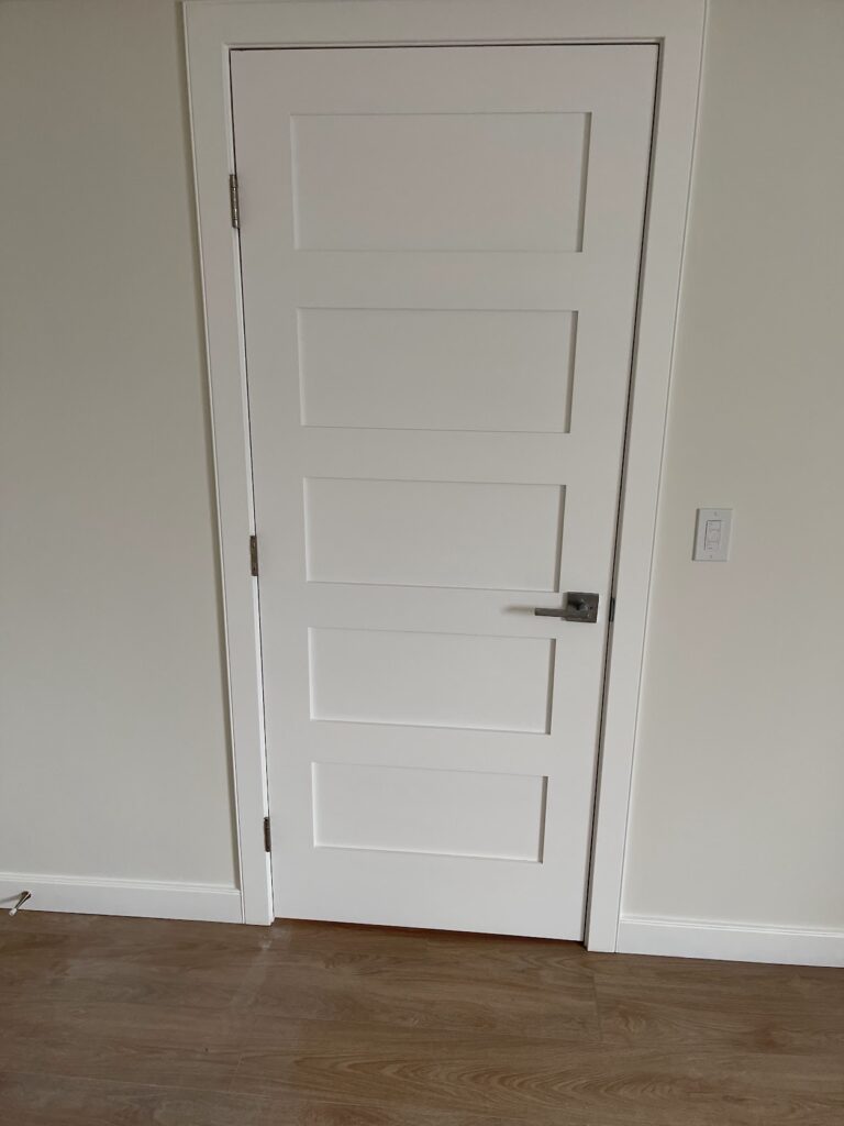 White interior door installation completed during Calgary home renovation