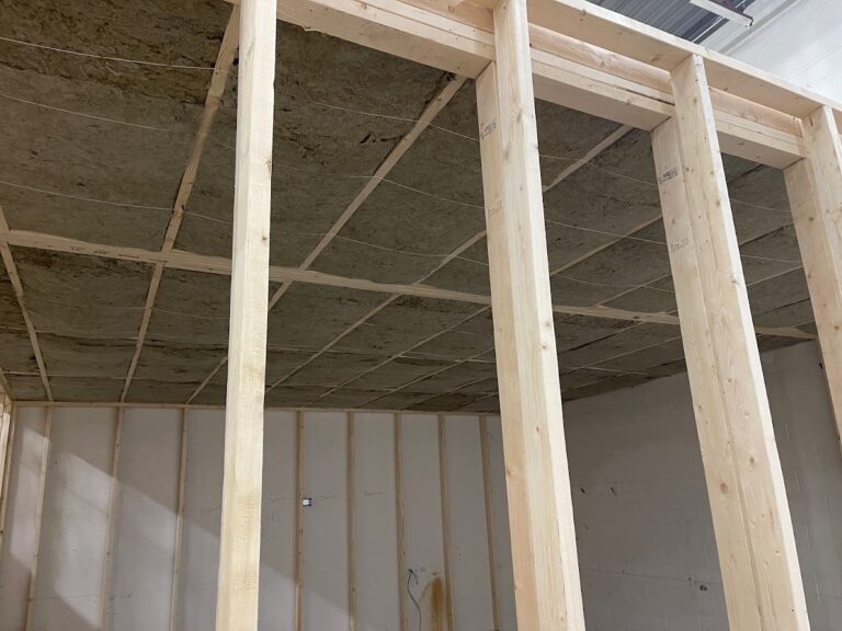 Interior wood framing installation during Calgary home renovation