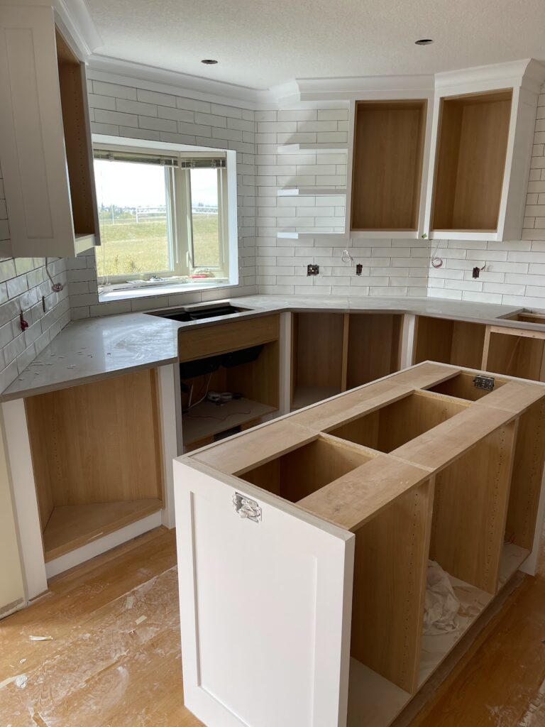 Kitchen cabinet and island renovation completed in Calgary home