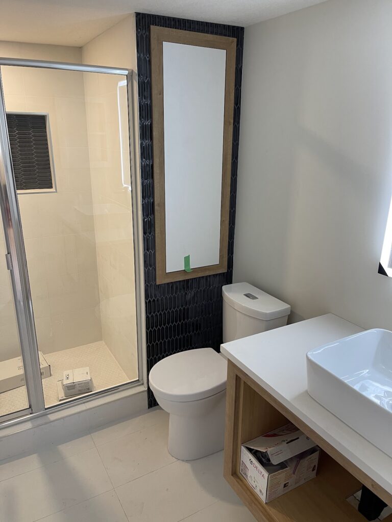 Modern bathroom upgrade with shower and vanity in Calgary home
