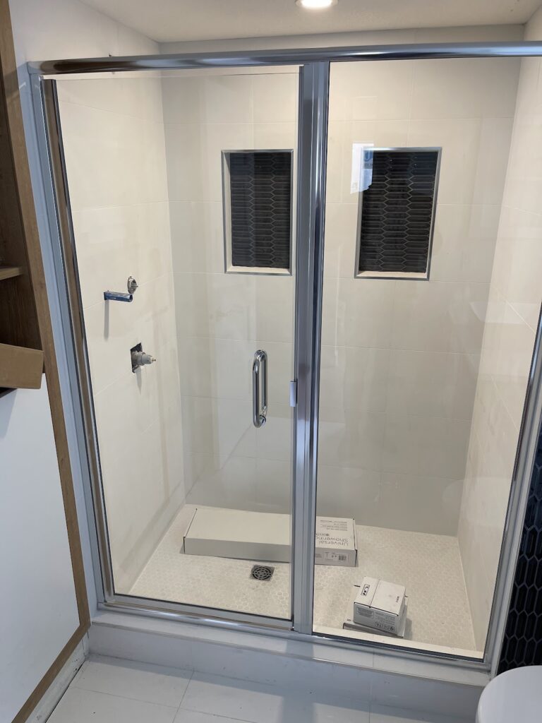Modern glass shower enclosure installed during Calgary bathroom renovation