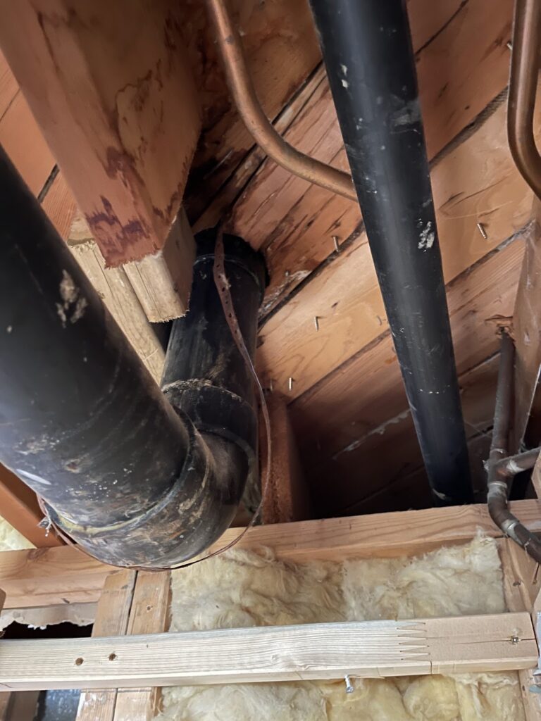 Structural framing exposed for repair near an exterior opening in Calgary home