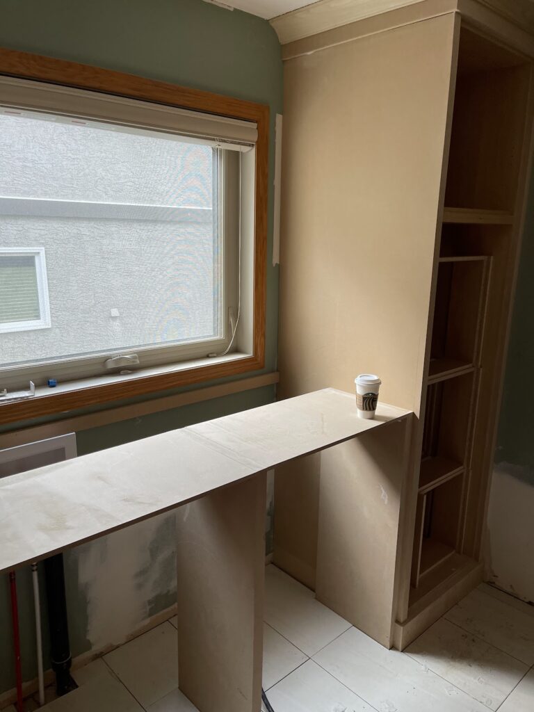 Interior window area with custom built-in finishing in Calgary home